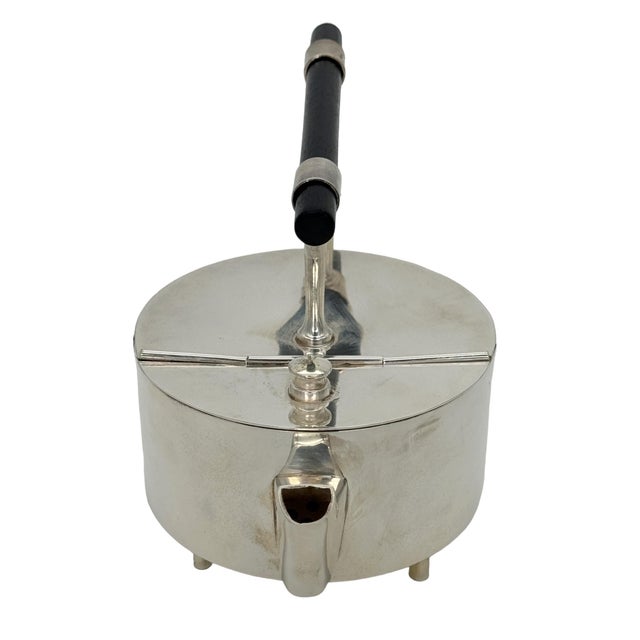 English Modernist Silver Plate Teapot, After Christopher Dresser 20th Century This striking modernist silver-plated teapot...