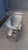 This small serving bar cast stands on wheels and is made of chromed metal with a mirror top.