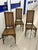 Set of three vintage Hollywood Regency dining chairs in stained faux-bamboo wood, with caned backs and caned seats,...