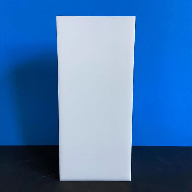 Sleek 1960s modern cube wall light or sconce by Lightolier of glossy white acrylic with single central light and original...