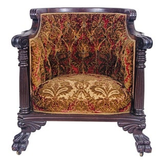 Jacobean Revival Carved Oak Armchair – Scroll Arms, Claw Feet & Figural Velvet Upholstery, C. 1920s For Sale