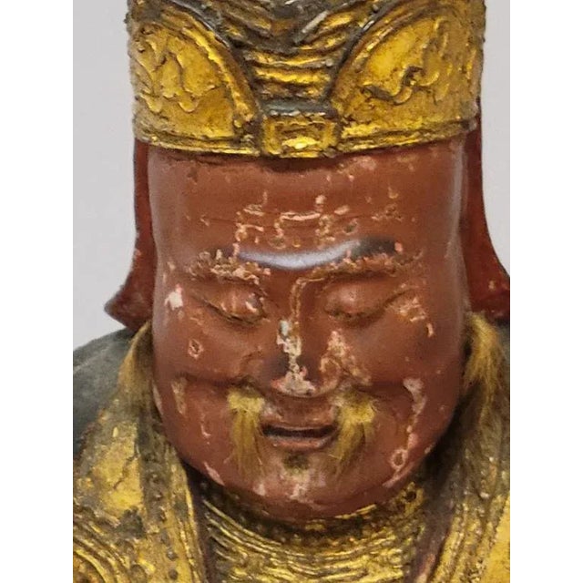 18/19th Century Chinese Gilt Lacquered Wood Carved Seated Temple Immortal Statue. There is some rubbing of gilding, chips,...
