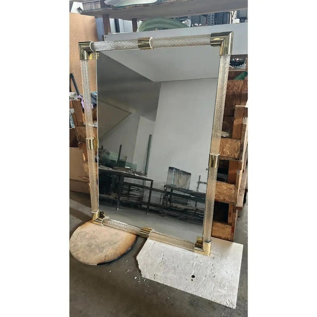 Rectangular gold “Torciglione” Murano Glass Wall Mirror. Scenographic wall mirror in brass elements with trasparent ando...
