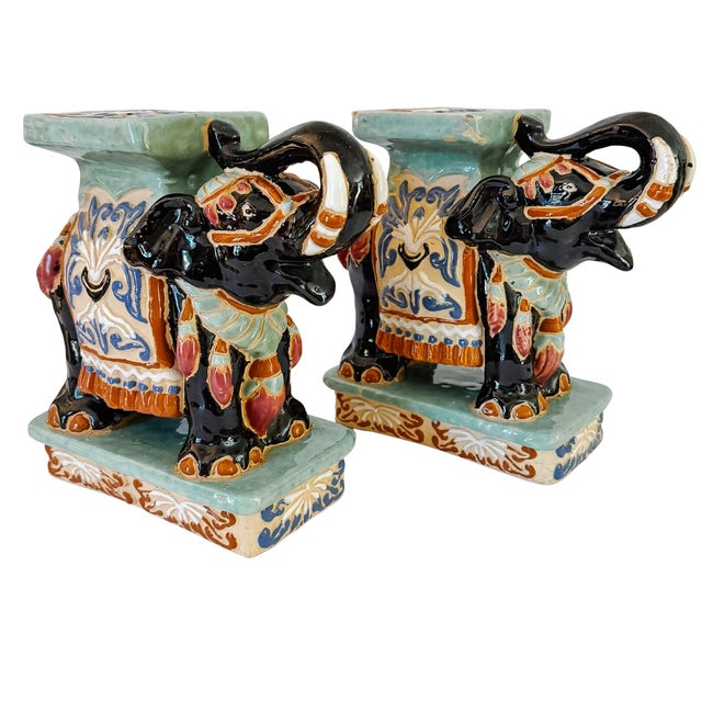 A vibrant pair of vintage glazed ceramic elephant stands, crafted in a rich Chinoiserie and Majolica-inspired aesthetic....