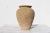 An hand made terracotta pot originally submerged under sea and used as a trap for an individual octopus. This pot has a...