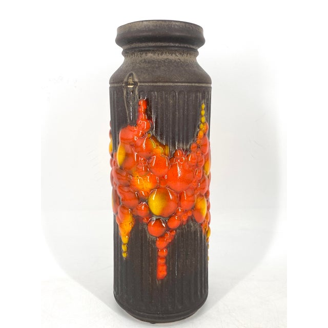 A vase * Exceptional floor vase * In the eccentric Fat Lava style of the 1960s * Vibrant orange/yellow colors * Marked on...