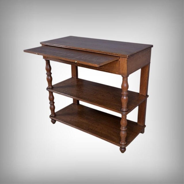 This sideboard embodies the elegant simplicity of the Louis-Philippe style with its meticulously crafted solid oak frame....