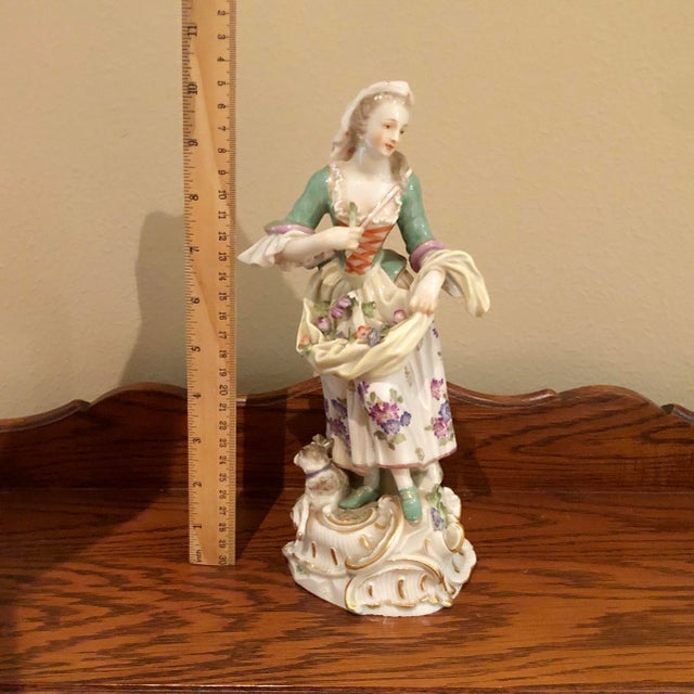 This is a genuine antique Meissen porcelain figurine of exceptional quality, dating to the late 19th or early 20th...