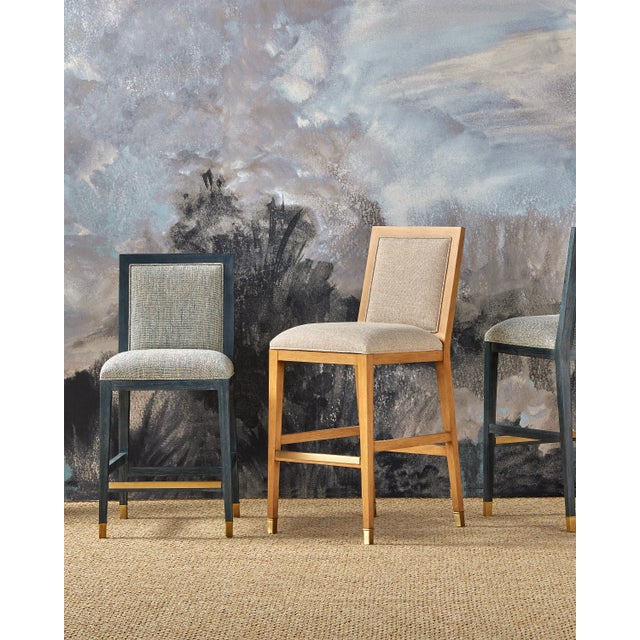 The Santos Vintage Navy Counter Stool has a split rattan pattern on the back, which is made by hand and applied to a solid...