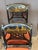 A set of eight 20th century Regency style hand-painted Chinoiserie decorated side chairs, each with a black ground painted...