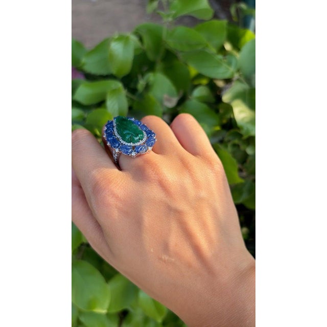 A very beautiful & gorgeous, Art deco style, Emerald & Blue Sapphire Cocktail Ring set in 18K White Gold & Diamonds. The...