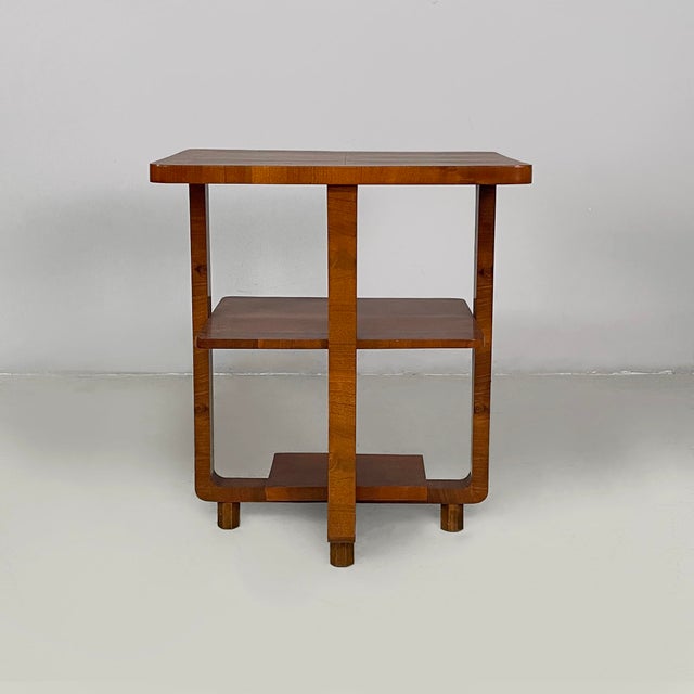 Italian Art Deco wood coffe table with double rectangular top, 1930s Coffee table with double rectangular wooden top. The...