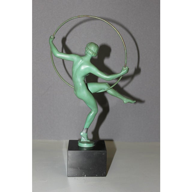 Dancer with a hoop, cast iron (spelter with a high tin content) with original green patina, signed in relief Briand...