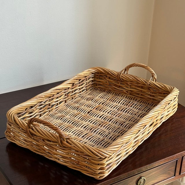 Offering a gorgeous late-20th century handwoven natural wicker tray. A nice large size, this tray features pretty French...