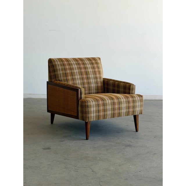 W29 D34.75 H29.75 SW22 SD21.74 SH16 A beautifully restored vintage lounge chair featuring warm walnut-toned wood, newly...