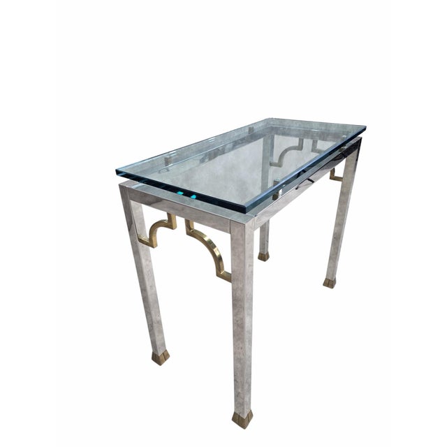 Mid Century Modern Chrome and Glass Console Table Mid-Century Modern chrome and glass console table with thick glass top...