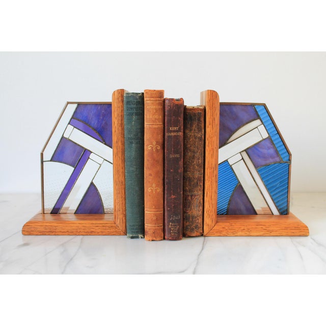 Pair of vintage wood and stained glass bookends. No makers mark. One small crack in glass. Pictured.