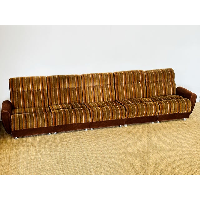 A five-seater modular vintage sofa with a retro design from the 1960s-1970s, featuring a beautiful, generous frame and...