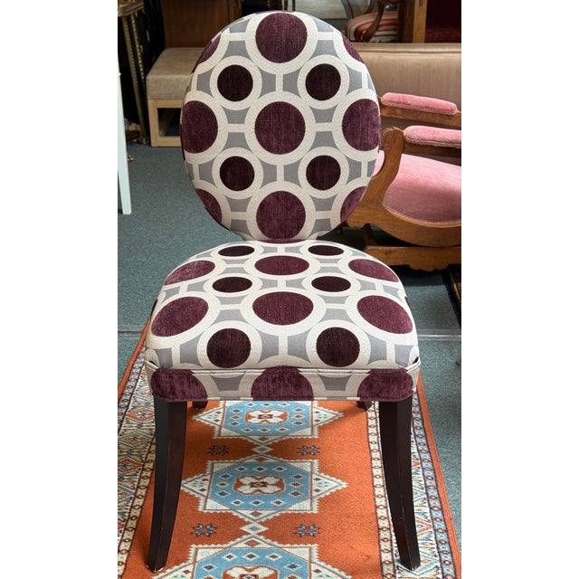 Design Plus Gallery presents a Geometric Dining Side Chair by Mitchell Gold. The chair has an oval shaped back and wide,...