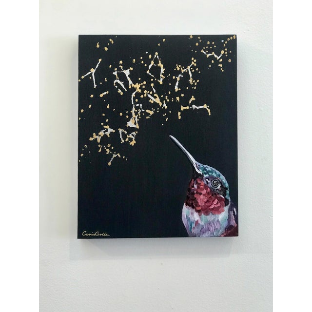 This artwork features a vibrant hummingbird rendered in rich colors, its intricate plumage contrasting against a deep...