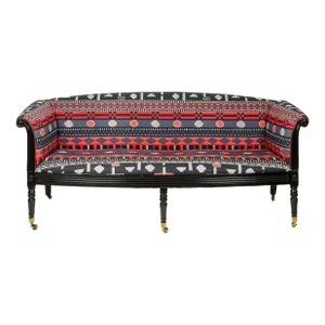 A Regency Style Ebonised and Upholstered Settee