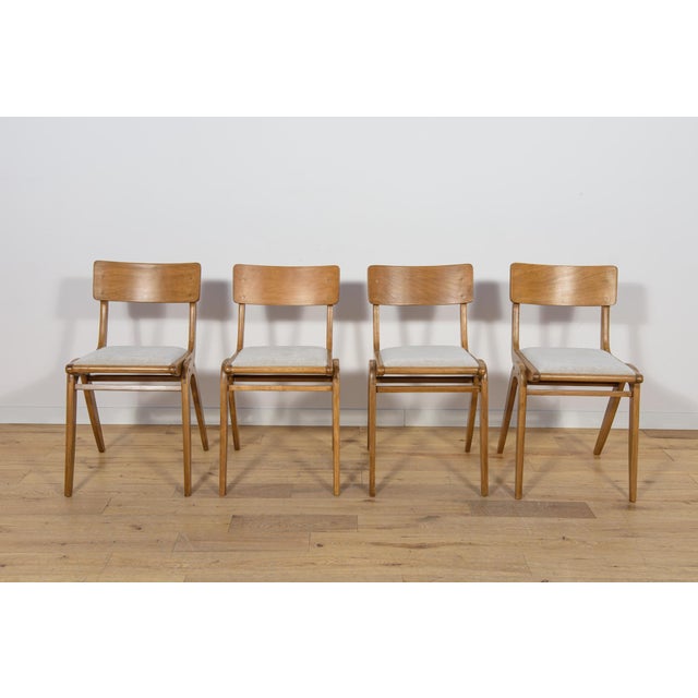 Set of 4 Polish dining chairs model Boomerang 229XB from Gościcińskie Furniture Factory in the 1960s. The frame of the...
