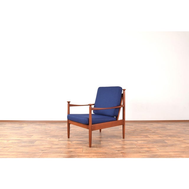 This armchair was made in Denmark in the 60's. The frame of the armchair is made of solid beech wood and has been...