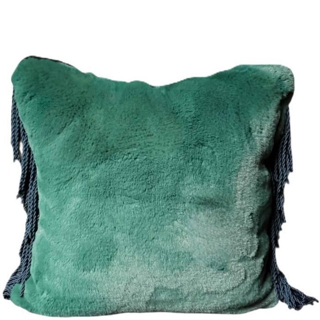Lush vegan Fur in a muted emerald green shade with lateral bullion fringe in teal. Size 45 cm × 45 cm | 17.7" × 17.7"...