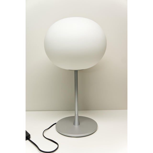 Designed by Jasper Morrison for FLOS in the 1990s, the Glo-Ball T1 Table Lamp provides soft, diffused light through a...