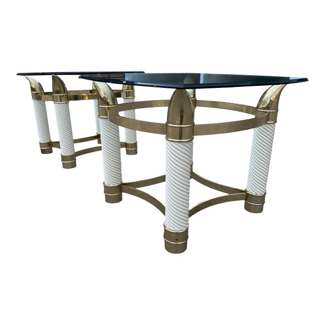 Fine pair of brass and faux ivory elephant tusk end tables, composed of twisted porcelain, heavy brass frames, and thick...