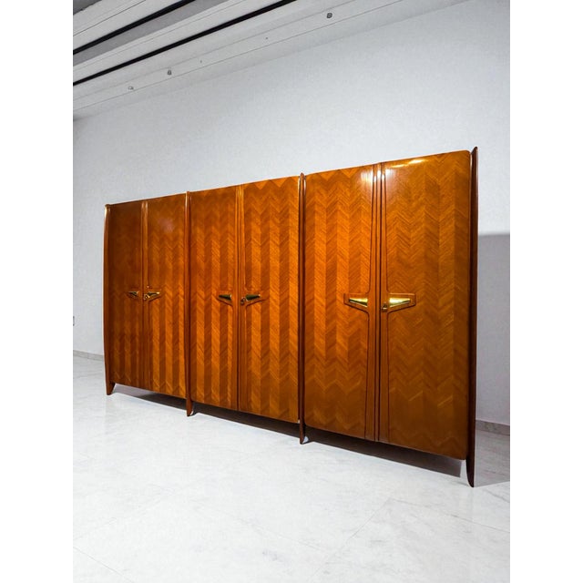 Rare version for this stylish Italian Wardrobe six doors of the 1950s, attributed to La Permanente Mobili Cantù. The...
