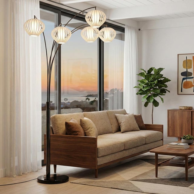 An iconic revival of Mervyn Weitz's 1976 ""Cloud"" lighting concept, the Bloom 5-Light Arc Lamp elevates ambient lighting...