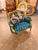 Bring the elegance of a French château into your home with this spectacular Louis XVI-inspired bergère armchair, richly...