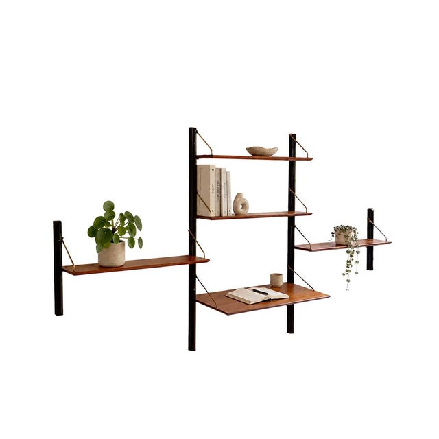 This vintage 3-piece wall system with desk by Louis van Teeffelen is a stunning example of Dutch mid-century design in...