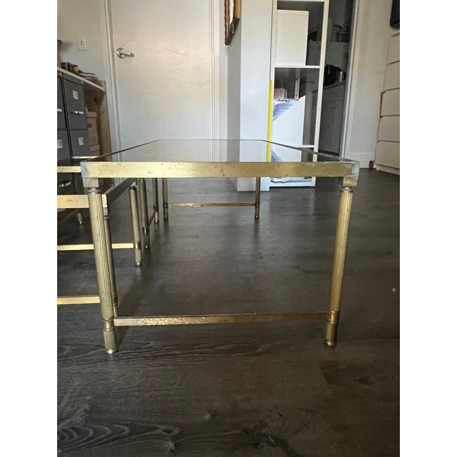 Charming Vintage Mid Century Modern Glass nesting tables. A larger table nest two smaller square tables. Decorative...