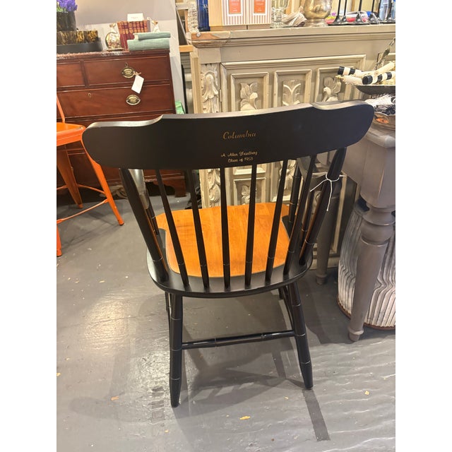 This is a vintage wooden armchair from Columbia University in 1953. It feature a crest as well as the university name,...
