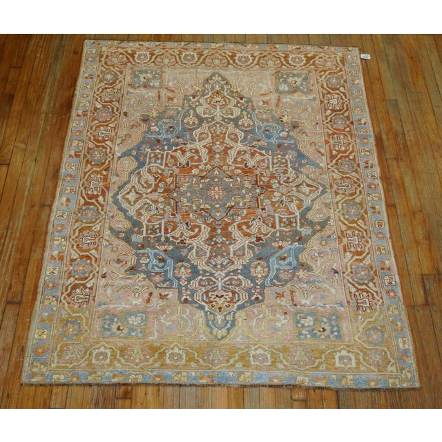 A 20th century Persian Square size bakhtiari rug with a elegant medallion border design in feminine colors.