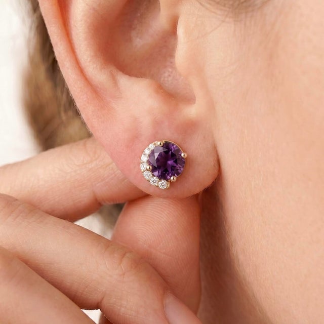 Add timeless elegance to your jewelry collection with these stunning Amethyst Stud Earrings. These earrings feature rich,...