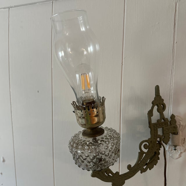 Salvaged from a 1920 Craftsman home in Rockford, Illinois, this original Bradley & Hubbard wall sconce is classic American...