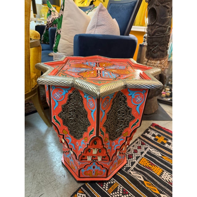 Brightly executed hand made and hand painted side table. It’s got 8 points edges on the top surface and the shape is...