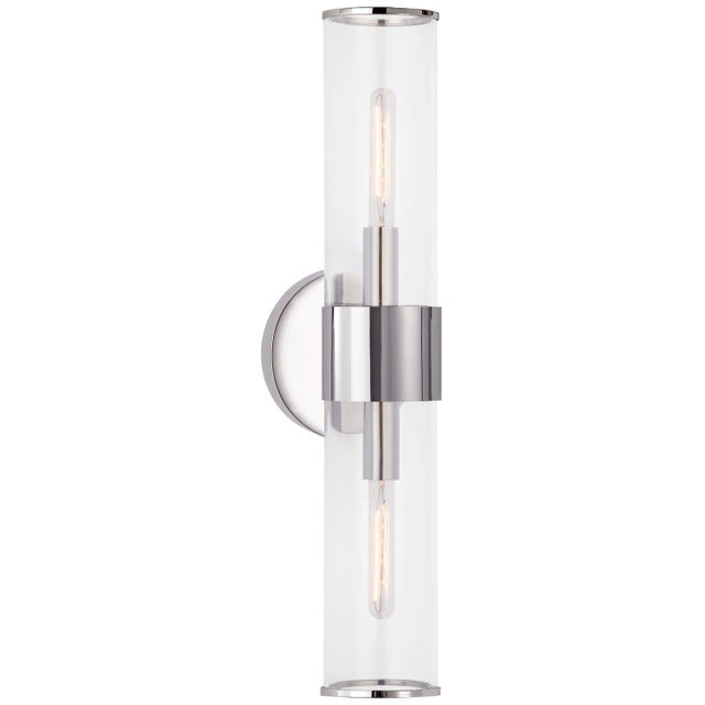 Liaison Medium Sconce in Polished Nickel with Clear Glass Designer: Kelly Wearstler Height: 22" Extension: 5" Backplate:...