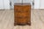 An Italian walnut and mahogany three-drawer chest from the 18th century with serpentine front, aged bronze hardware and...