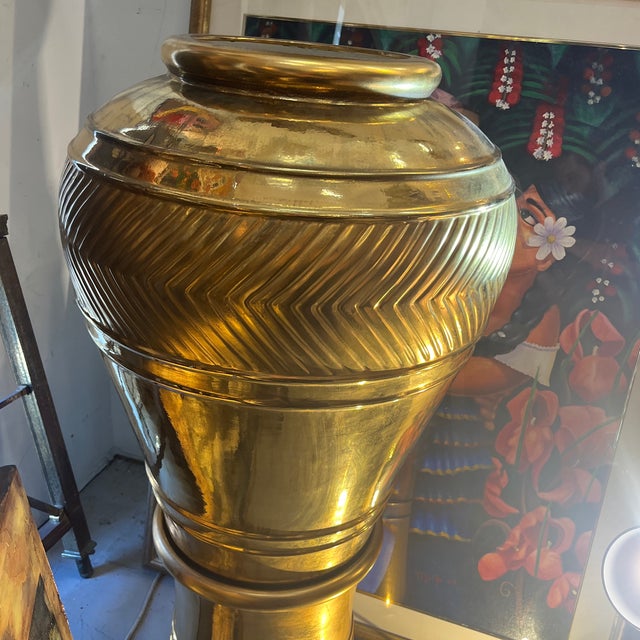 EG Cody Gold Finished Vase/Urn with matching base. WOW! Retail $5400. minor paint chips as photographed. Approximately 49”...