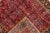 Beautiful Persian vintage Heriz hand-knotted wool rug with a red field. This piece has multicolor accents in an all-over...