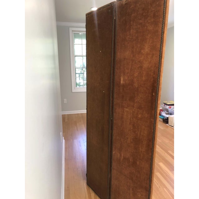 Antique velvet three-panel folding room divider screen upholstered in a worn chocolate-brown velvet, with brass nail heads...