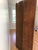 Antique velvet three-panel folding room divider screen upholstered in a worn chocolate-brown velvet, with brass nail heads...