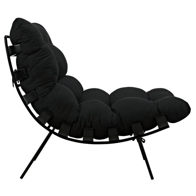 Sink into the Hanzo chair, a larger scale chaise-type chair with a charcoal black industrial metal frame and ribs and a...