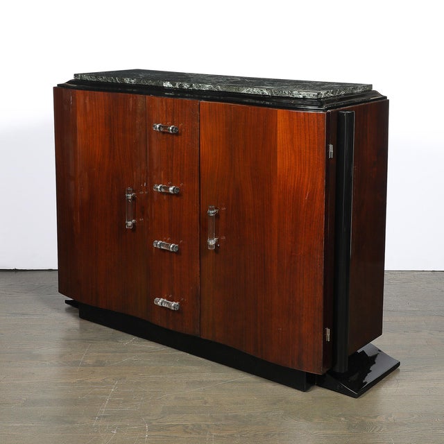 This sensuous Art Deco Walnut &amp; Black Lacquer Curved-Front Cabinet w/ Verde Saint Denis Top originated in France,...