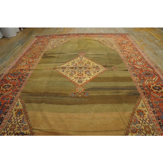 The strongly, but interestingly, abrashed open camel ground shows at least four weavers at work simultaneously. The...