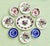 Vintage English Curated Plate Wall Collection - Mid-20th Century - 9 Plates Anchored by a striking Royal Cauldon...